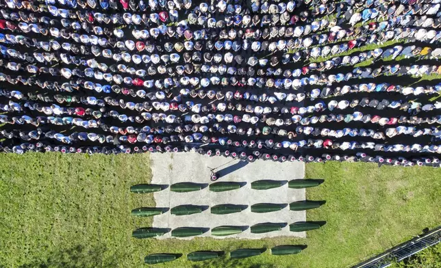 An aerial view of the collective funeral for 19 victims of a landslide caused by recent floods in Jablanica, Bosnia, Tuesday, Oct. 15, 2024. (AP Photo/Armin Durgut)