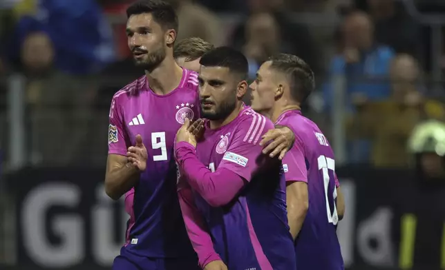 German players celebrate after a goal during the Nations League soccer match between Bosnia and Germany in Zenica, Bosnia and Herzegovina, on Friday, Oct. 11, 2024. (AP Photo/Armin Durgut)