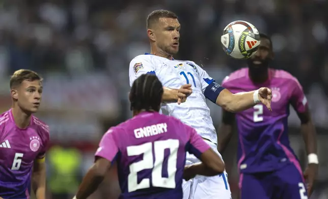 Bosnia's Edin Dzeko receives the ball during the Nations League soccer match between Bosnia and Germany in Zenica, Bosnia and Herzegovina, on Friday, Oct. 11, 2024. (AP Photo/Armin Durgut)