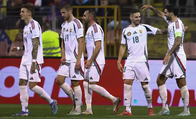 Hungarian players celebrate after a goal during the Nations League soccer match between Bosnia and Hungary in Zenica, Bosnia and Herzegovina, on Monday, Oct. 14, 2024. (AP Photo/Armin Durgut)