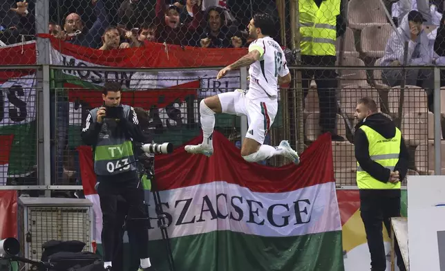 Hungary's Dominik Szoboszlai celebrates after he scored during the Nations League soccer match between Bosnia and Hungary in Zenica, Bosnia and Herzegovina, on Monday, Oct. 14, 2024. (AP Photo/Armin Durgut)