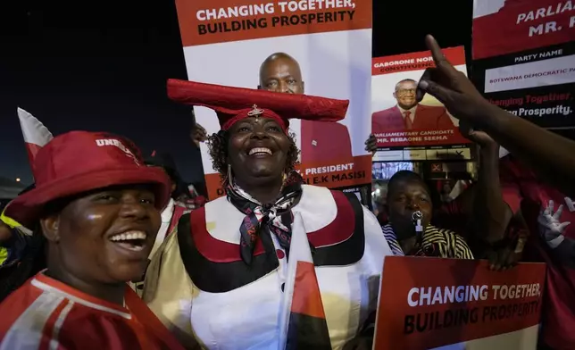 Members of the Botswana Democratic Party cheer their leader during election rally, a day before elections in Gaborone, Botswana, Tuesday, Oct. 29, 2024. (AP Photo/Themba Hadebe)