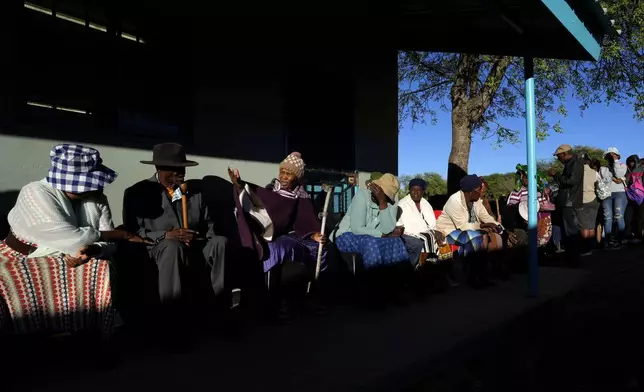 Residents wait for their turns to cast their votes during an election to decide if it keeps faith with one of the Africa's longest-ruling parties, in Gaborone, Botswana, Wednesday, Oct. 30, 2024. (AP Photo/Themba Hadebe)