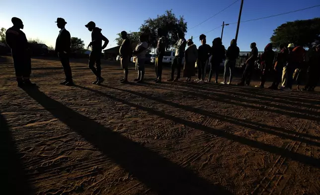 Residents wait to cast their vote during an election in Gaborone, Botswana, Wednesday, Oct. 30, 2024. (AP Photo/Themba Hadebe)