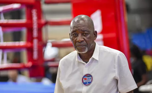 Alfred Mamba, who witnessed as a child the Ali-Foreman "rumble in the jungle" fight 50-years ago, poses for a photograph in Kinshasa, Democratic Republic of the Congo, Saturday, Oct. 26, 2024. (AP Photo/Samy Ntumba Shambuyi)