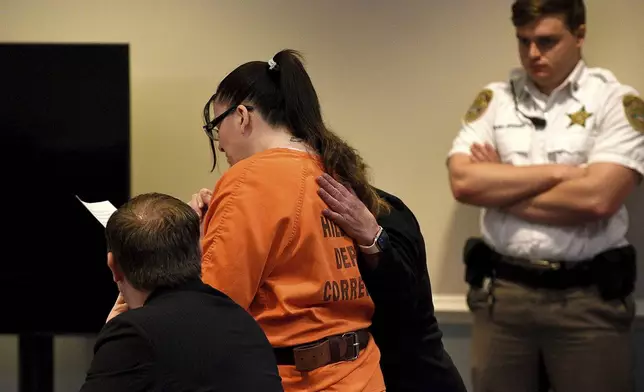 Danielle Dauphinais, who pleaded guilty last month to second-degree murder and other charges in the death of her 5-year old son Elijah Lewis in 2021, reads a statement at her sentencing hearing at Hillsborough County Superior Court South in Nashua, N.H., on Friday, Oct. 25, 2024. (David Lane/Union Leader via AP, Pool)