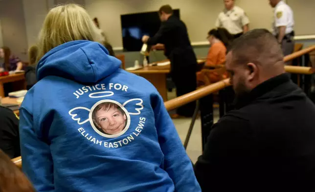 Lisa Chasse of Nashua, N.H., wears a sweatshirt with a photo of Elijah Lewis at the sentencing hearing for Danielle Dauphinais at Hillsborough County Superior Court South in Nashua, N.H., on Friday, Oct. 25, 2024. (David Lane/Union Leader via AP, Pool)