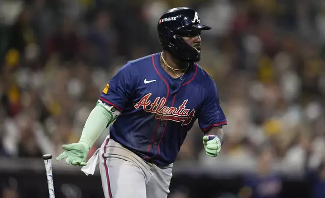 Atlanta Braves' Michael Harris II drops his bat as he hits a two-run home run during the eighth inning in Game 2 of an NL Wild Card Series baseball game Wednesday, Oct. 2, 2024, in San Diego. (AP Photo/Gregory Bull)