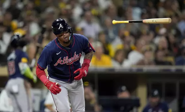 Atlanta Braves' Orlando Arcia tosses his bat as he flies out during the fifth inning in Game 1 of an NL Wild Card Series baseball game against the San Diego Padres,Tuesday, Oct. 1, 2024, in San Diego. (AP Photo/Gregory Bull)