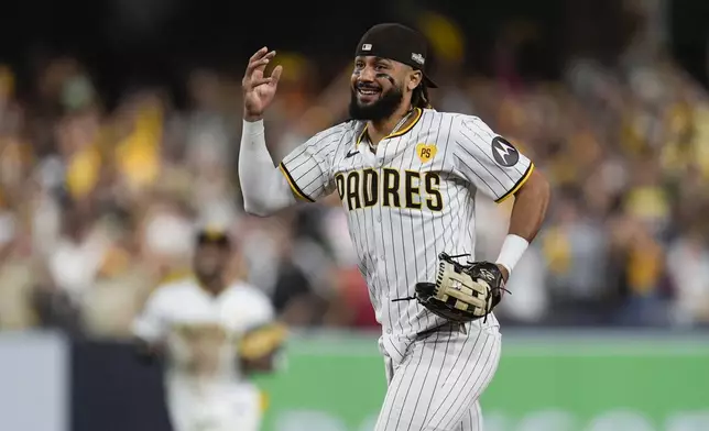 San Diego Padres' Fernando Tatis Jr. smiles after a win over the Atlanta Braves in Game 2 of an NL Wild Card Series baseball game Wednesday, Oct. 2, 2024, in San Diego. (AP Photo/Gregory Bull)