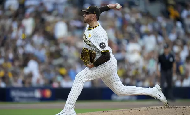 San Diego Padres starting pitcher Joe Musgrove throws to an Atlanta Braves batter during the first inning in Game 2 of an NL Wild Card Series baseball game Wednesday, Oct. 2, 2024, in San Diego. (AP Photo/Gregory Bull)