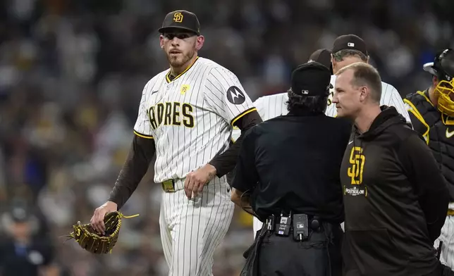 San Diego Padres starting pitcher Joe Musgrove exits the game during the fourth inning in Game 2 of an NL Wild Card Series baseball game against the Atlanta Braves, Wednesday, Oct. 2, 2024, in San Diego. (AP Photo/Gregory Bull)