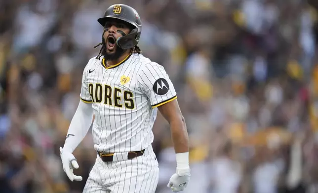 San Diego Padres' Fernando Tatis Jr. celebrates after hitting a two-run home run during the first inning in Game 1 of an NL Wild Card Series baseball game against the Atlanta Braves, Tuesday, Oct. 1, 2024, in San Diego. (AP Photo/Gregory Bull)