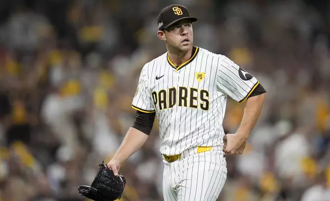 San Diego Padres starting pitcher Michael King walks off the mound after getting the third out during the sixth inning in Game 1 of an NL Wild Card Series baseball game against the Atlanta Braves, Tuesday, Oct. 1, 2024, in San Diego. (AP Photo/Gregory Bull)