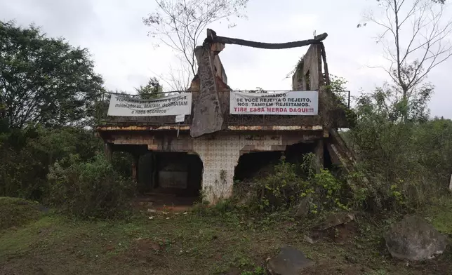 A home that was destroyed by a dam break stands in ruins in Bento Rodrigues, Minas Gerais state, Brazil, Oct. 19, 2024. Victims of Brazil’s worst environmental disaster, on Nov. 5, 2015, took their case for compensation to a UK court on Monday, Oct. 21, 2024, almost nine years after tons of toxic mining waste poured into a major waterway, killing 19 people and devastating local communities. (AP Photo/Eleonore Hughes)