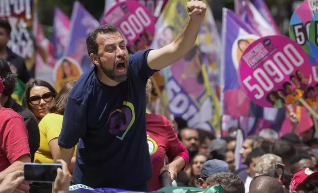 Mayoral candidate Guilherme Boulos of the Socialism and Liberty Party campaigns the day before elections in Sao Paulo, Saturday, Oct. 5, 2024. (AP Photo/Andre Penner)