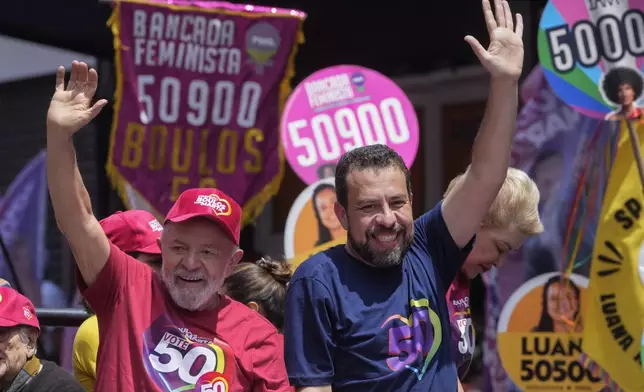 Brazilian President Luiz Inacio Lula da Silva, left, campaigns with mayoral candidate Guilherme Boulos of the Socialism and Liberty Party the day before elections in Sao Paulo, Saturday, Oct. 5, 2024. (AP Photo/Andre Penner)