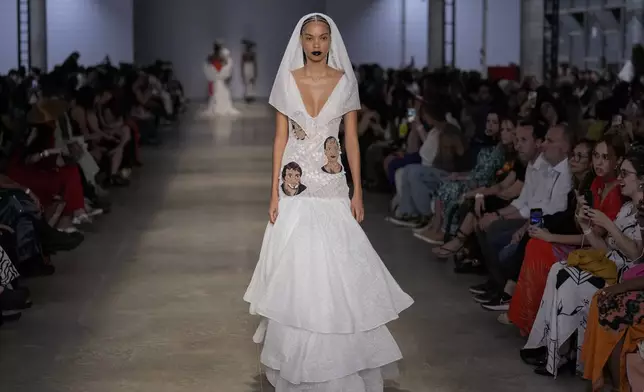 A model wears a creation from the Cria Costura collection during Sao Paulo Fashion Week in Sao Paulo, Thursday, Oct. 17, 2024. (AP Photo/Andre Penner)