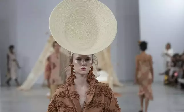 A model wears a creation from the Foz collection during Sao Paulo Fashion Week in Sao Paulo, Wednesday, Oct. 16, 2024. (AP Photo/Andre Penner)