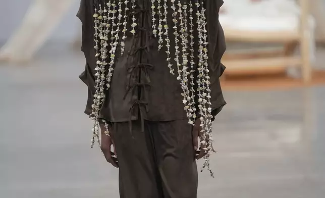 A model wears a creation from the Foz collection during Sao Paulo Fashion Week in Sao Paulo, Wednesday, Oct. 16, 2024. (AP Photo/Andre Penner)