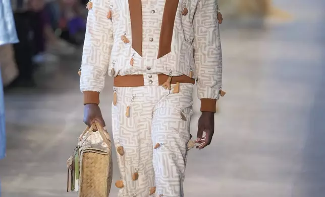 A model wears a creation from the Heloisa Faria collection during Sao Paulo Fashion Week in Sao Paulo, Brazil, Thursday, Oct. 17, 2024. (AP Photo/Andre Penner)