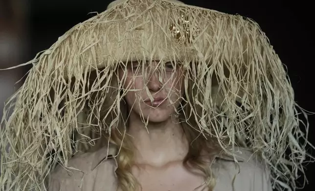 A model wears a creation from the Salinas collection during Sao Paulo Fashion Week in Sao Paulo, Brazil, Thursday, Oct. 17, 2024. (AP Photo/Andre Penner)