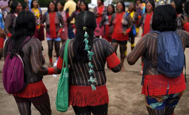 Indigenous groups take part in protest against a proposed constitutional amendment that threatens some of their land rights, in Brasilia, Brazil, Wednesday, Oct. 30, 2024. (AP Photo/Eraldo Peres)