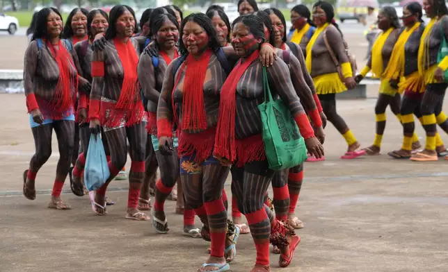 EDS NOTE: NUDITY - Indigenous women take part in protest against a proposed constitutional amendment that threatens some of their land rights, in Brasilia, Brazil, Wednesday, Oct. 30, 2024. (AP Photo/Eraldo Peres)