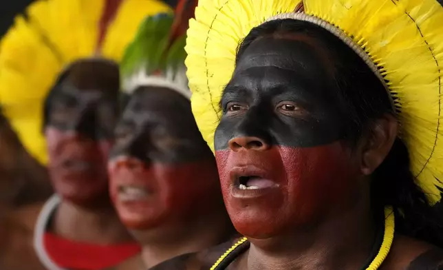 Kayapos sing during a protest against a proposed constitutional amendment that threatens some Indigenous land rights, in Brasilia, Brazil, Wednesday, Oct. 30, 2024. (AP Photo/Eraldo Peres)