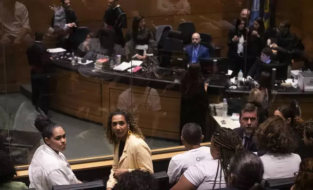 Luyara Santos, from left, and Minister of Racial Equality Anielle Franco, the daughter, and sister of slain councilwoman Marielle Franco, attend the trial of Franco's suspected murderers, at the Court of Justice in Rio de Janeiro, Wednesday, Oct. 30, 2024. (AP Photo/Bruna Prado)