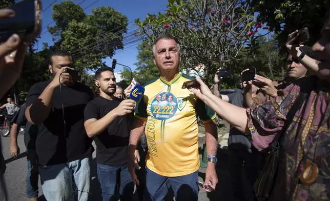 Former President Jair Bolsonaro supports Rio de Janeiro mayoral candidate Alexandre Ramagem, not pictured, during municipal elections in Rio de Janeiro, Sunday, Oct. 6, 2024. (AP Photo/Bruna Prado)