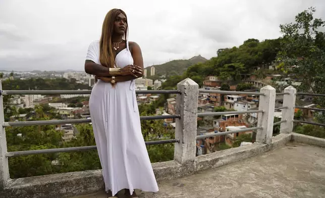 Benny Briolly, a transgender woman running for city council, poses for a photo during a campaign event with supporters and members of her campaign team in Morro do Estado, in Niteroi, Rio de Janeiro state, Brazil, Saturday, Sept. 28, 2024. (AP Photo/Hannah-Kathryn Valles)