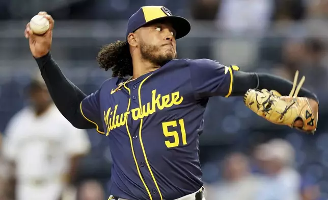 Milwaukee Brewers starting pitcher Freddy Peralta delivers during the first inning of a baseball game against the Pittsburgh Pirates, Wednesday, Sept. 25, 2024, in Pittsburgh. (AP Photo/Matt Freed)