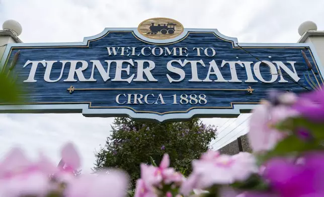 A community welcome sign on the corner Main Street and Dundalk Avenue is pictured, Friday, Aug. 16, 2024, in Turner Station, Md. (AP Photo/Stephanie Scarbrough)