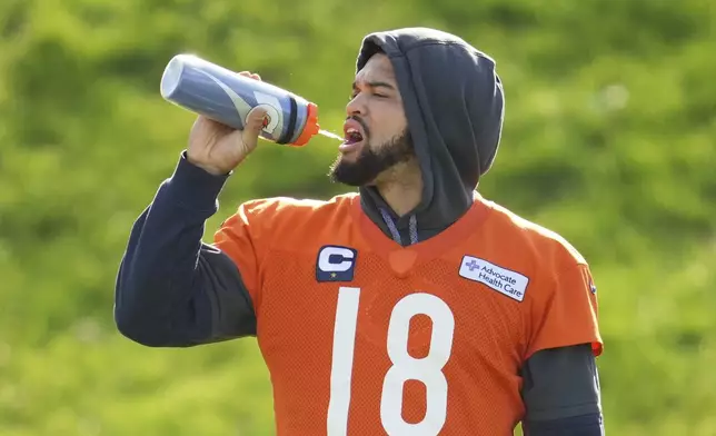 Chicago Bears quarterback Caleb Williams (18) participates in a NFL football training session in Ware, England, Friday, Oct. 11, 2024, ahead of the game against the Jacksonville Jaguars at the Tottenham Hotspur stadium on Sunday. (AP Photo/Kin Cheung)