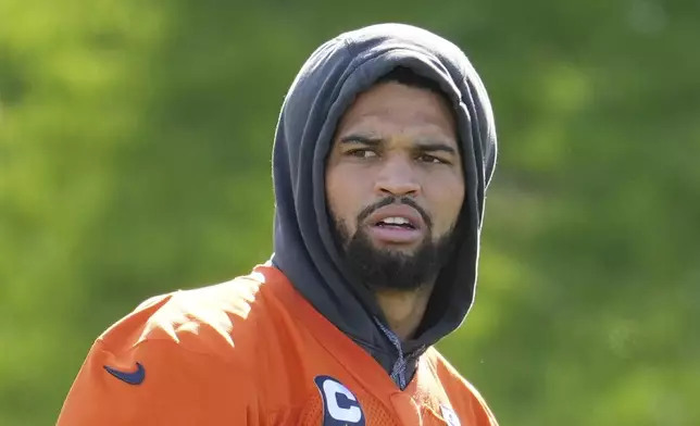 Chicago Bears quarterback Caleb Williams (18) participates in a NFL football training session in Ware, England, Friday, Oct. 11, 2024, ahead of the game against the Jacksonville Jaguars at the Tottenham Hotspur stadium on Sunday. (AP Photo/Kin Cheung)