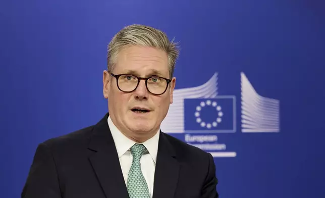 Britain's Prime Minister Keir Starmer speaks to the media at the European Commission headquarters in Brussels, Wednesday, Oct. 2, 2024. (Benjamin Cremel, Pool Photo via AP)