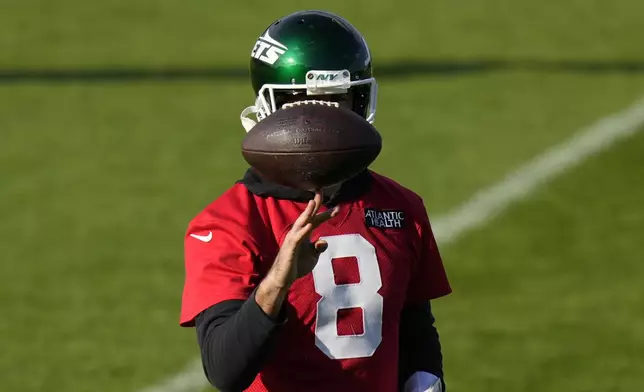 New York Jets quarterback Aaron Rodgers (8) participates in a training session in Ware, England, Friday, Oct. 4, 2024, ahead of the game between New York Jets and Minnesota Vikings at the Tottenham Hotspur stadium on Sunday. (AP Photo/Alastair Grant)