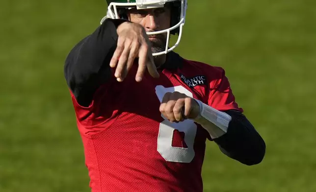 New York Jets quarterback Aaron Rodgers (8) participates in a training session in Ware, England, Friday, Oct. 4, 2024, ahead of the game between New York Jets and Minnesota Vikings at the Tottenham Hotspur stadium on Sunday. (AP Photo/Alastair Grant)