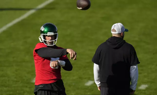 New York Jets quarterback Aaron Rodgers (8) participates in a training session in Ware, England, Friday, Oct. 4, 2024, ahead of the game between New York Jets and Minnesota Vikings at the Tottenham Hotspur stadium on Sunday. (AP Photo/Alastair Grant)