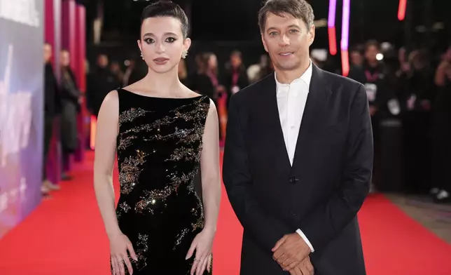 Mikey Madison, left and director Sean Baker pose for photographers upon arrival at the premiere of the film 'Anora' during the London Film Festival on Friday, Oct. 11, 2024, in London. (Photo by Scott A Garfitt/Invision/AP)