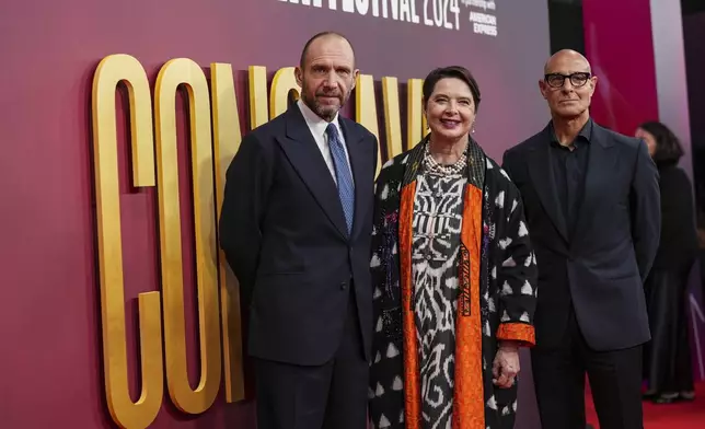 Ralph Fiennes, from left, Isabella Rossellini and Stanley Tucci, pose for photographers upon arrival at the premiere of the film 'Conclave' during the London Film Festival on Thursday, Oct. 10, 2024, in London. (Photo by Scott A Garfitt/Invision/AP)