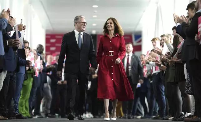 FILE - Britain's Prime Minister Keir Starmer and his wife, Victoria, arrive at the Labour Party Conference in Liverpool, England, Tuesday, Sept. 24, 2024.(AP Photo/Jon Super, File)