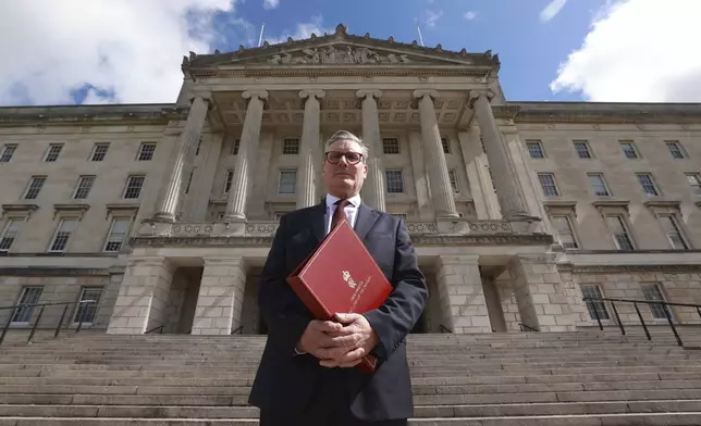 FILE - Britain's Prime Minister Sir Keir Starmer poses for a photo outside Parliament Buildings, following a meeting with party leaders, during his tour of the UK following Labour's victory in the 2024 general election, in Stormont, Belfast, Monday July 8, 2024. (Liam McBurney/Pool Photo via AP, File)