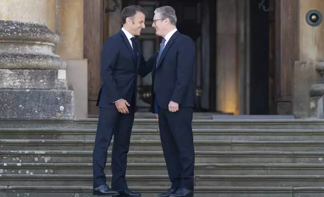 FILE - French President Emmanuel Macron, left, is welcomed by British Prime Minister Keir Starmer to the European Political Community summit at Blenheim Palace in Woodstock, Oxfordshire, England, Thursday July 18, 2024. (Stefan Rousseau/PA via AP, Pool, File)