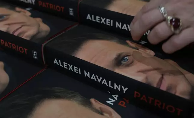 Copies of the late Russian opposition leader Alexei Navalny's memoir entitled 'Patriot' are put display on the first day of sale in a bookshop in London, Tuesday, Oct. 22, 2024. (AP Photo/Alastair Grant)