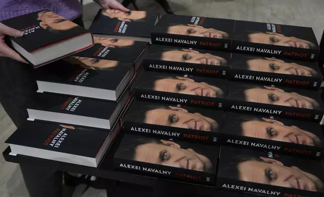 Copies of the late Russian opposition leader Alexei Navalny's memoir entitled 'Patriot' are put display on the first day of sale in a bookshop in London, Tuesday, Oct. 22, 2024. (AP Photo/Alastair Grant)