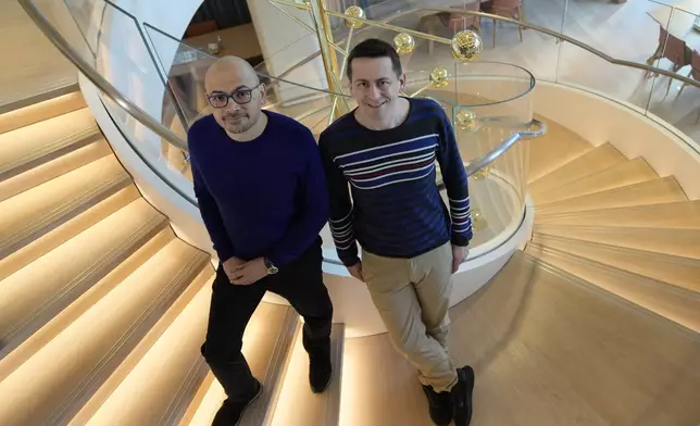 Researcher John Jumper, left, and Demis Hassabis, CEO of DeepMind Technologies, the AI division behind Gemini, speak to Associated Press at the Google DeepMind offices in London, Wednesday, Oct. 9, 2024 after being awarded with the Nobel Prize in Chemistry.(AP Photo/Alastair Grant)