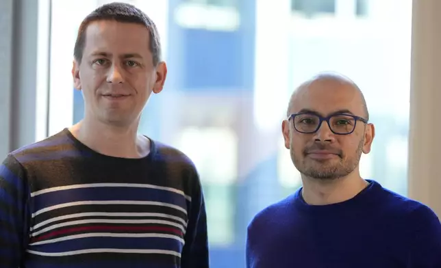 Researcher John Jumper, left, and Demis Hassabis, CEO of DeepMind Technologies, the AI division behind Gemini, speak to Associated Press at the Google DeepMind offices in London, Wednesday, Oct. 9, 2024 after being awarded with the Nobel Prize in Chemistry.(AP Photo/Alastair Grant)