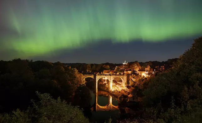 The Northern Lights, also known as the Aurora Borealis, are seen in the sky over Knaresborough, England, Friday, Oct. 11, 2024. (Andrew Hawkes via AP)